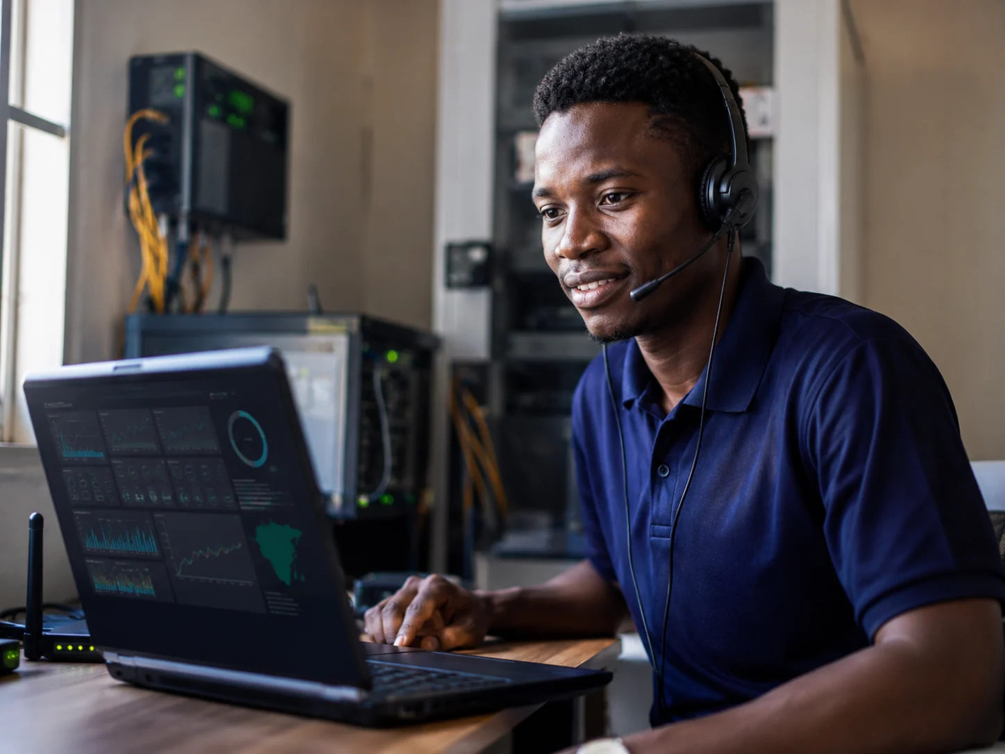 YITTA technician monitoring network support operations